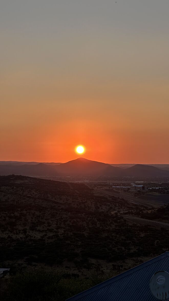 Sunset von Terrasse Rivercrossing Lodge