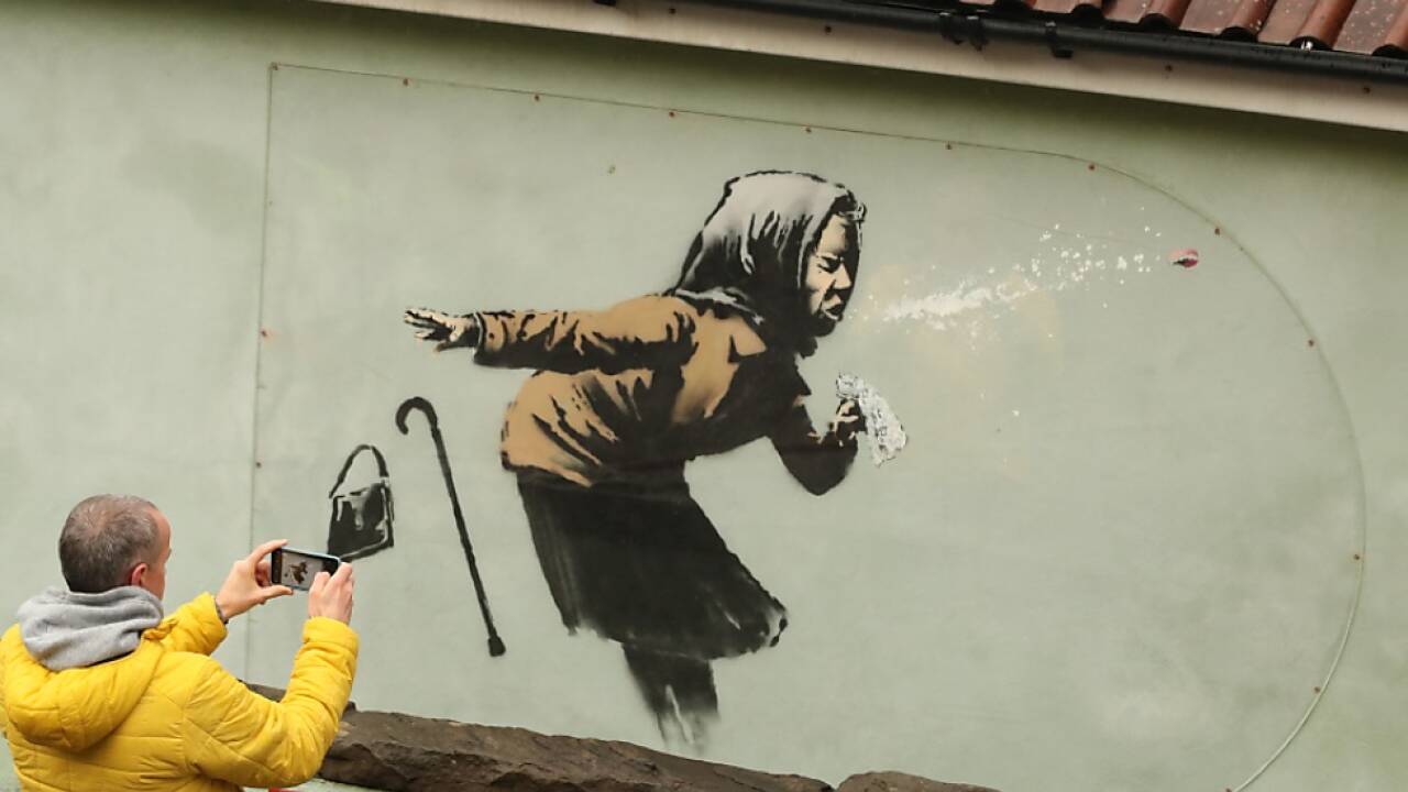 Werke von Banksy sind ein sehr beliebtes Fotomotiv Werke von Banksy sind ein sehr beliebtes Fotomotiv