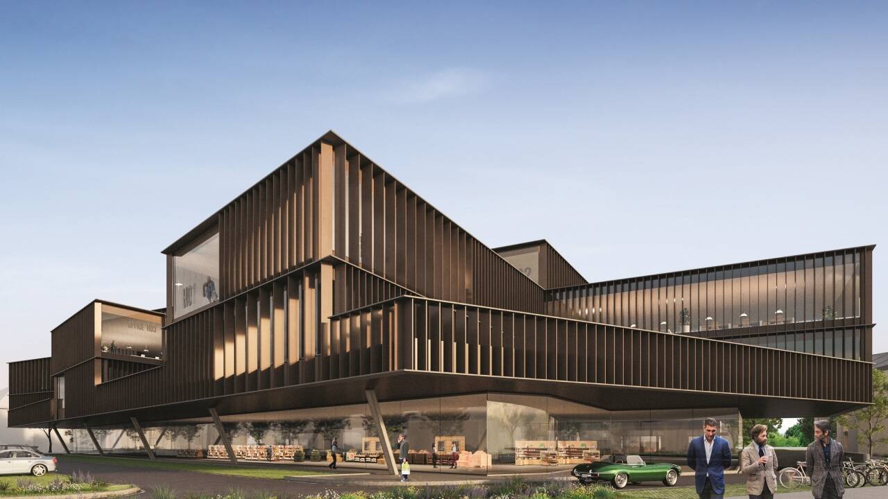 Das lang gezogene Büro- und Geschäftsgebäude fungiert als Filter zur Hauptstraße. Das lang gezogene Büro- und Geschäftsgebäude fungiert als Filter zur Hauptstraße.