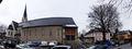 Pfarrkirche St. Maximillian mit dem Maxglaner Pfarrhof.jpg