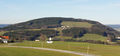 Irrsberg, 844m, Neumarkt am Wallersee, davor das Zeughaus der Feuerwehr Sommerholz.JPG