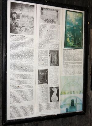 Geschichtliche Infotafel bei der Mühlbergkirche.jpg